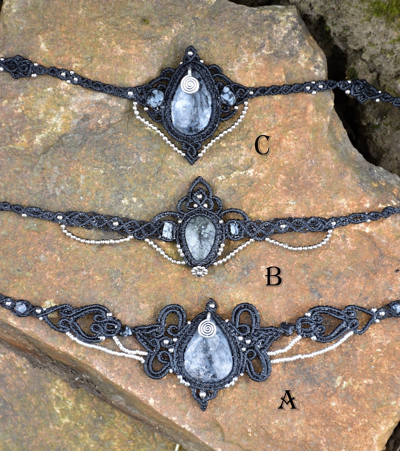 May include: Three black macrame chokers with silver beads and a teardrop-shaped clear quartz crystal pendant. The chokers are labeled A, B, and C.