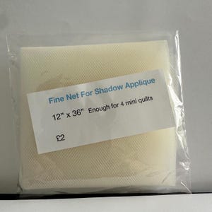 May include: A pack of white fine net fabric for shadow applique. The pack is labelled "Fine Net For Shadow Applique 12" x 36" Enough for 4 mini quilts £2".