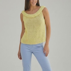 May include: A sleeveless, yellow knitted top with a wide, rounded neckline. The top is paired with light blue pants. The knitted fabric has a textured appearance. The outfit is suitable for casual wear.