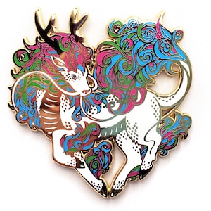 May include: Gold-tone enamel pin featuring a stylized white creature with blue, green, and pink swirling patterns. The creature has a long, flowing mane and a single horn.