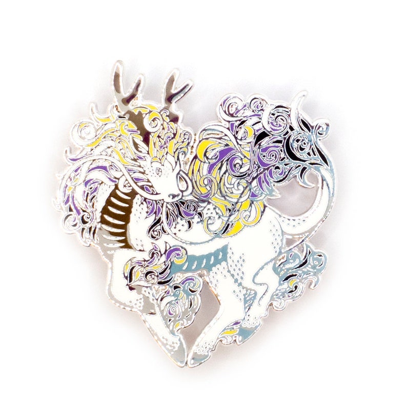 May include: A silver-toned enamel pin depicting a stylized dragon with yellow, purple, and white accents. The dragon is in a heart shape and has intricate details.