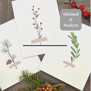 Może przedstawiać: Trzy minimalistyczne wydruki artystyczne z ilustracjami botanicznymi. Jeden wydruk przedstawia gałązkę z czerwonymi jagodami, drugi gałąź sosny ze szyszką, a trzeci zieloną, liściastą gałąź. Wydruki są przyklejone do białego tła. Tekst "Minimal & Modern" znajduje się w szarej kwadracie.