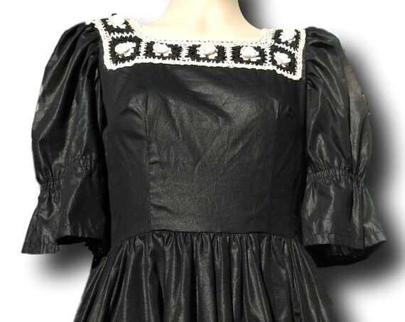 Black crochet midi dress, crocheted with puffy sleeves.