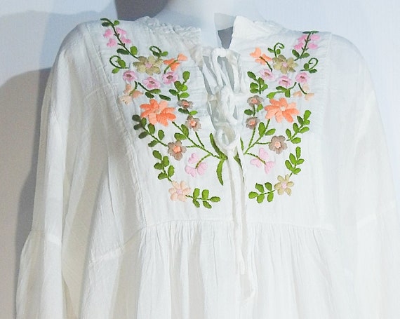 Long sleeve white boho dress with Mexican embroidery.