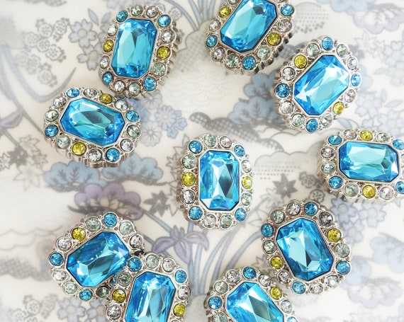 Large blue rhinestone buttons