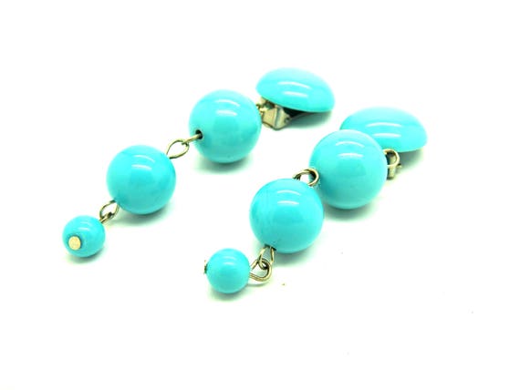 Big ball earrings for non pierced ears.