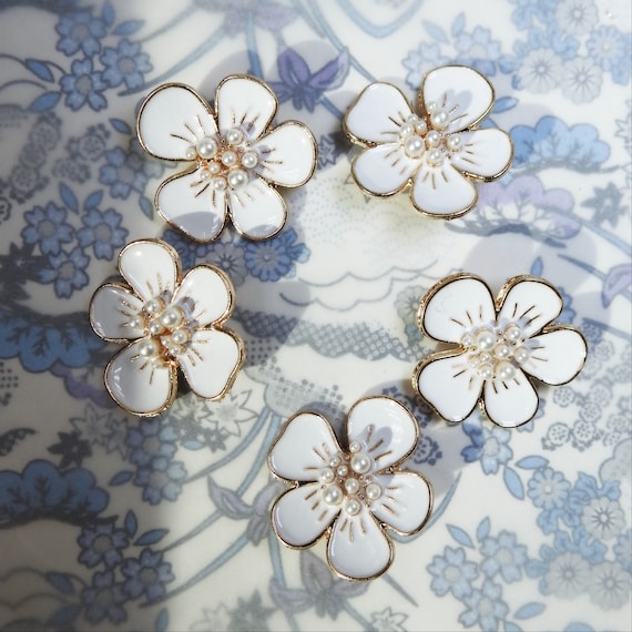 White and gold flower buttons