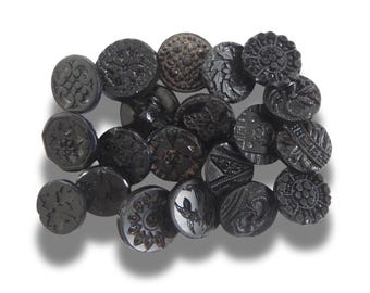 20 Czech black glass buttons from Europe. Perfect embellishments for thrifted or inherited garments—perfect for upcycling. With a shank back