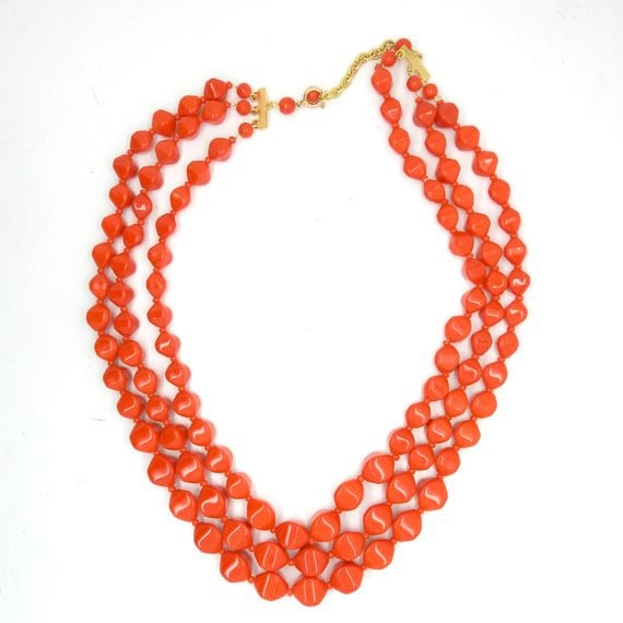 Statement jewelry red multi strand necklace.