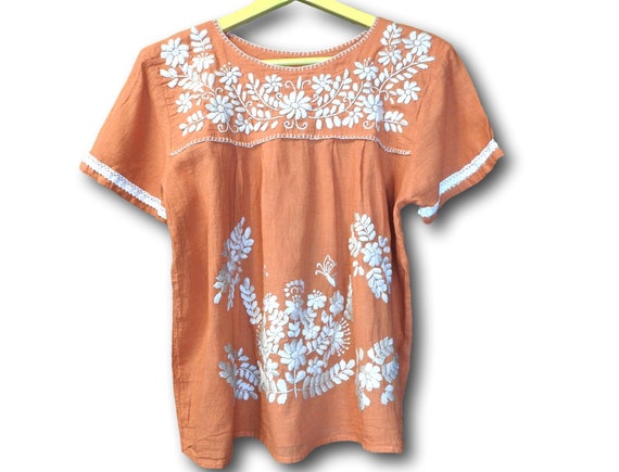 Burnt orange floral embroidered blouse with Mexican embroidery.