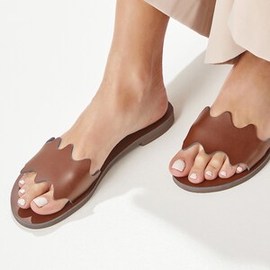 Women Brown Leather Flip Flops with an over the foot wavy strap