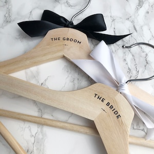 Bride and groom wedding hangers with black and white satin bows gift set of two engagement gift bride to be