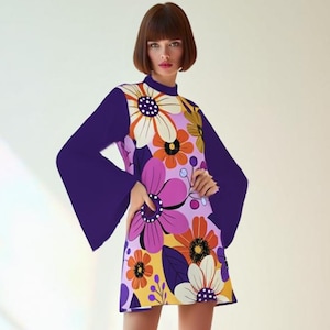 May include: A retro-style mini dress with a floral pattern in purple, orange, white, and yellow. The dress has long, bell sleeves and a high neckline. Paired with bright pink knee-high boots.