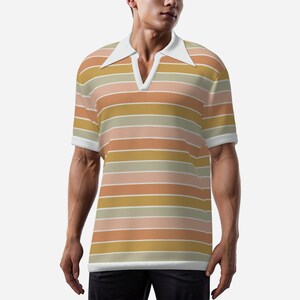 May include: A short-sleeved polo shirt with a retro design. The shirt has horizontal stripes in shades of orange, pink, yellow, and white. It features a white collar and cuffs, and a V-neck opening.