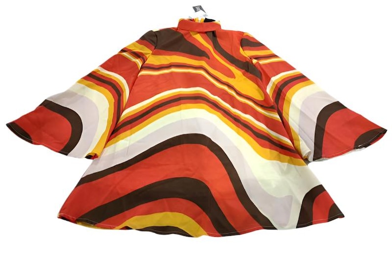 May include: A red, orange, yellow, brown, and white patterned dress with long sleeves and a high neck.
