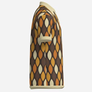 May include: A short-sleeved polo shirt with a retro leaf pattern in shades of brown, orange, and cream. The shirt has a cream-colored collar and cuffs. The fabric appears to be ribbed.