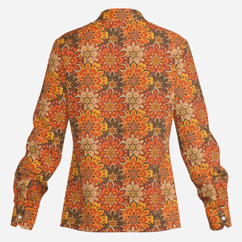 May include: A long-sleeved shirt with a colorful floral pattern in shades of orange, yellow, brown, and white. The shirt has a button-up collar and a fitted silhouette.