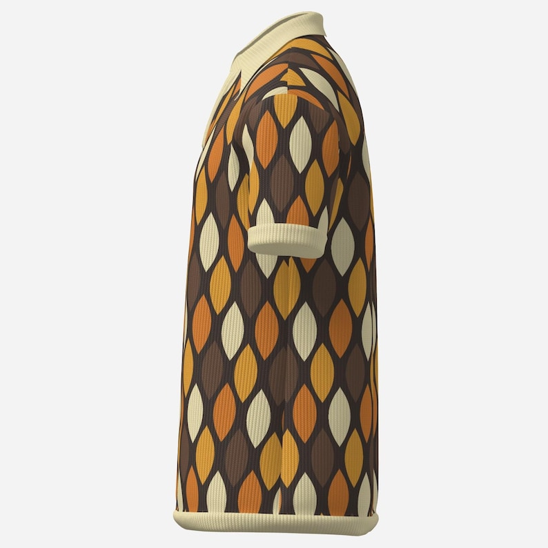 May include: A short-sleeved polo shirt with a retro design. The shirt features a repeating pattern of elongated, leaf-like shapes in shades of brown, orange, and cream. The collar and sleeve cuffs are a solid cream color, and the shirt has a ribbed texture.