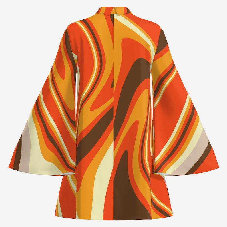 May include: A long-sleeved dress with a swirling pattern in shades of orange, brown, and cream. The dress has a high neckline and bell sleeves.