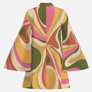 May include: A short-sleeved dress with a retro-inspired swirl pattern in shades of pink, yellow, green, and orange. The dress has a collared neckline and a flared skirt.