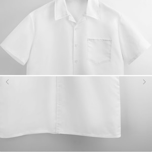 Pu&ograve; includere: Una camicia bianca a maniche corte con bottoni e una singola tasca sul petto. La camicia ha un colletto ed &egrave; realizzata in un tessuto liscio e leggero.