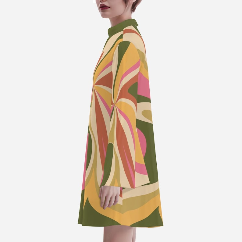 May include: A short-sleeved dress with a high neck and a colorful abstract pattern in shades of yellow, orange, pink, and green.
