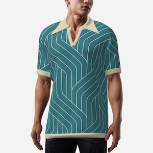 May include: Teal polo shirt with a cream-colored collar and cuffs. The shirt features a repeating white, curved line pattern. The shirt has a V-neck design and short sleeves. The shirt is made of a knit fabric.