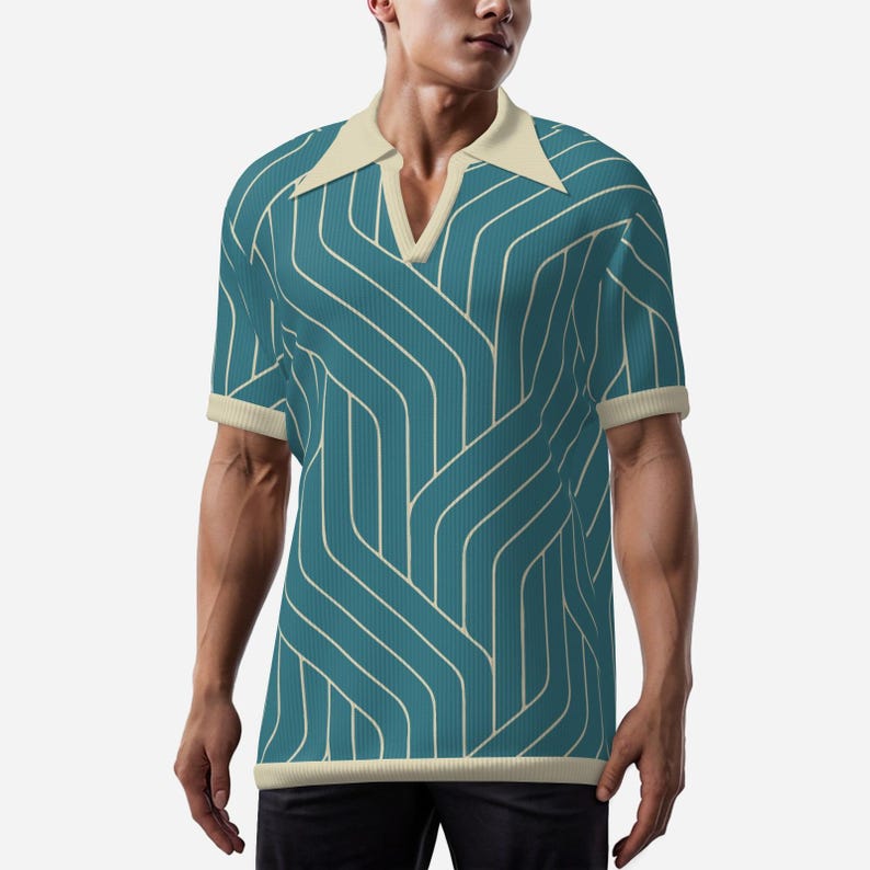 May include: Teal polo shirt with a cream-colored collar and cuffs. The shirt features a repeating white, curved line pattern. The shirt has a V-neck design and short sleeves. The shirt is made of a knit fabric.