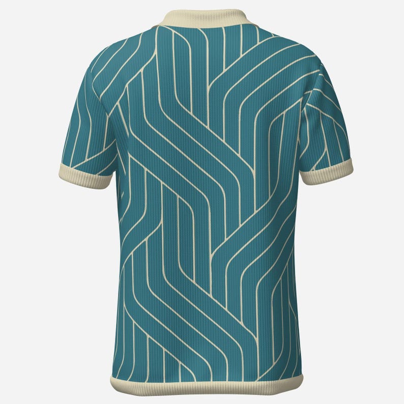May include: Teal polo shirt with a cream-colored collar and sleeve cuffs. The shirt features a repeating white geometric pattern. The fabric has a ribbed texture. The shirt is a short-sleeved top.