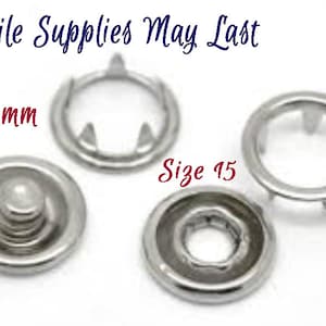 May include: Four silver metal snap fasteners, two with prongs and two with a dome-shaped top. The prongs are 9.5mm in diameter and the dome-shaped tops are labeled "Size 15".