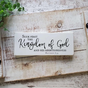 May include: White wooden tray with black handles and a white sign that reads "Seek first the Kingdom of God and His Righteousness Matthew 6:33"