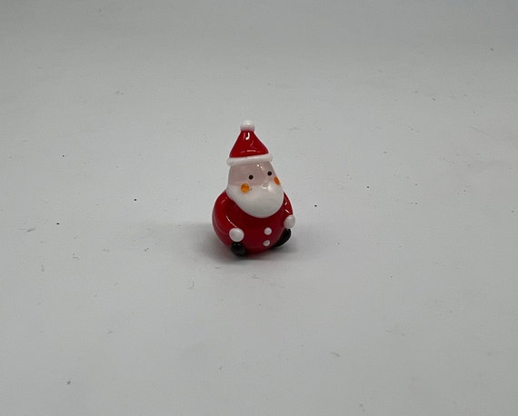 Miniature Santa sitting