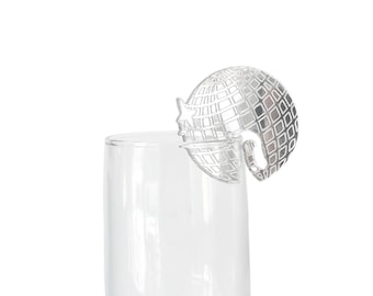 May include: Silver disco ball shaped glass charm for a champagne flute.