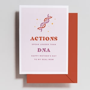 May include: A pink card with a pink and orange DNA strand graphic. The card reads "Actions speak louder than DNA. Happy Mother's Day to my real mom."
