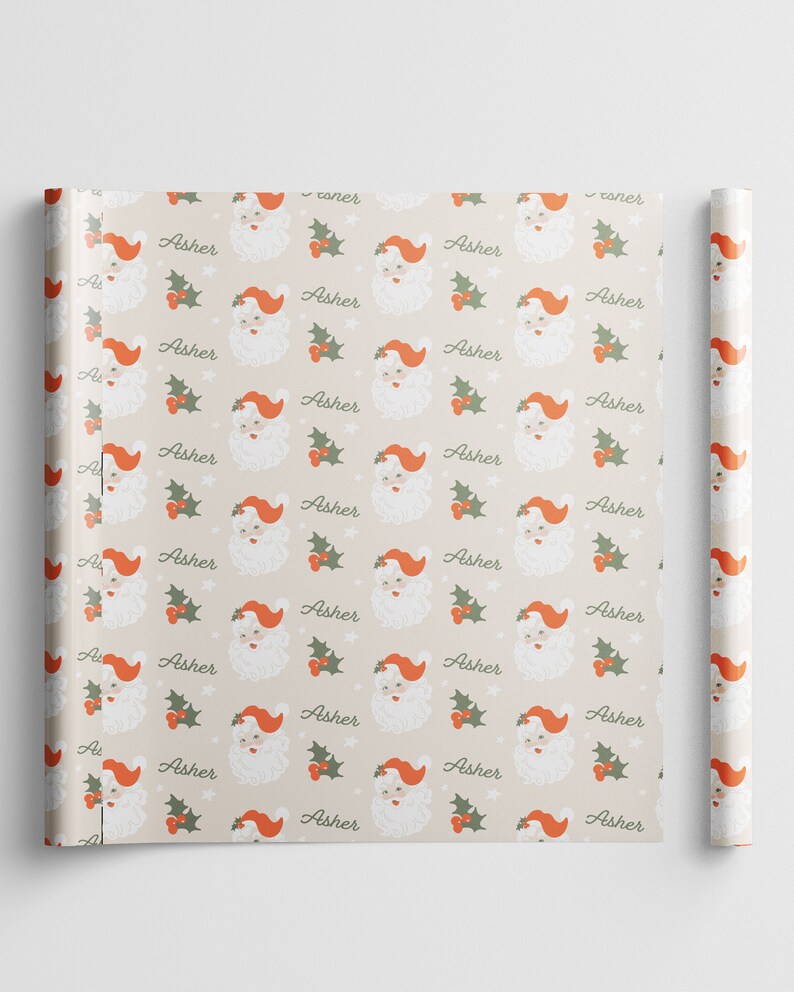 May include: Beige wrapping paper with a repeating pattern of Santa Claus faces with red hats and white beards. The pattern also includes green holly leaves and red berries. The word "Asher" is repeated throughout the pattern.
