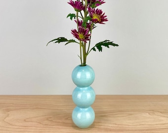 Light blue ceramic bud vase