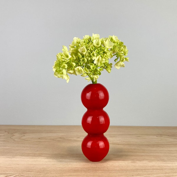 red ceramic bud vase