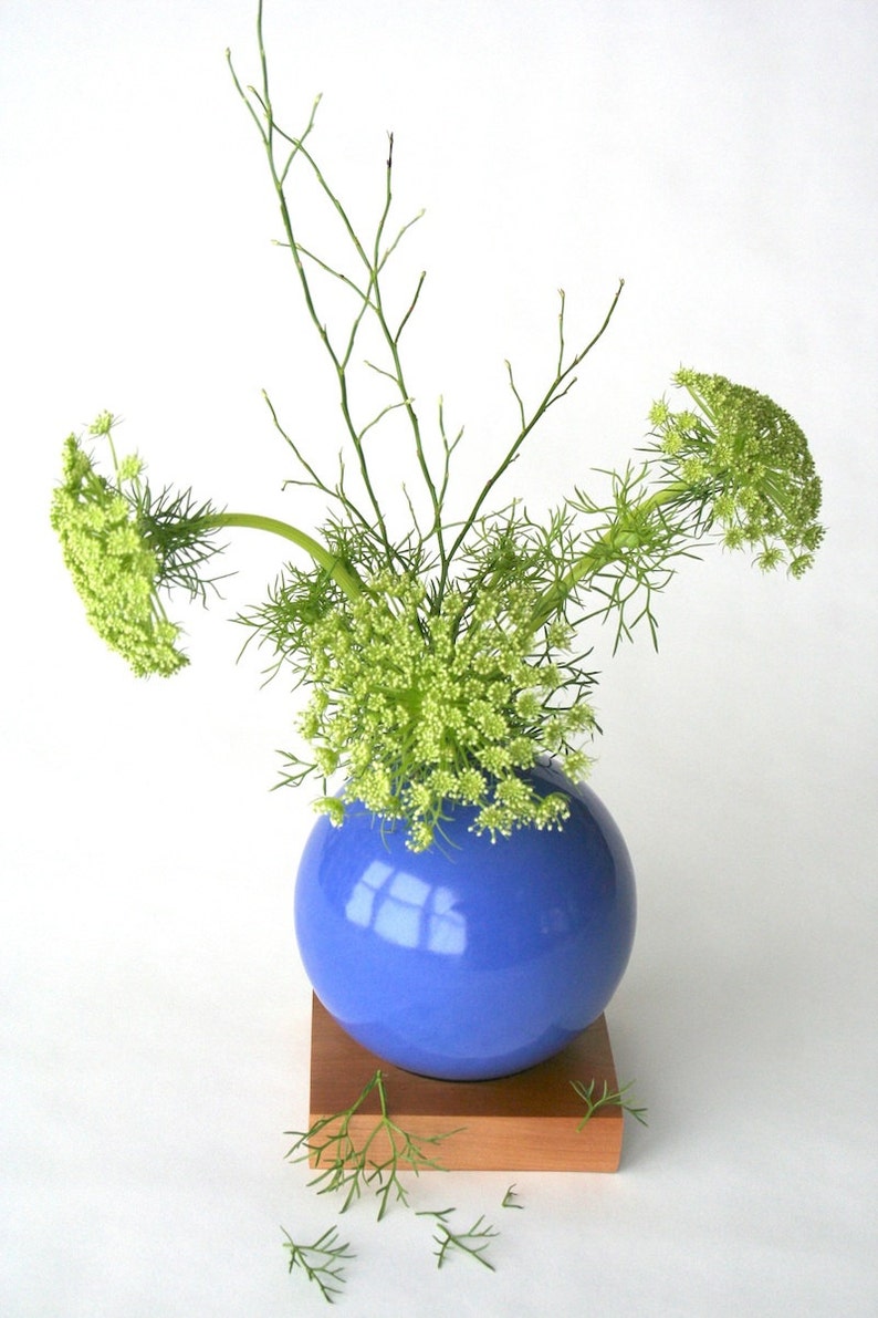 blue ceramic vase on wood base image 4