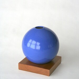 blue ceramic vase on wood base image 2