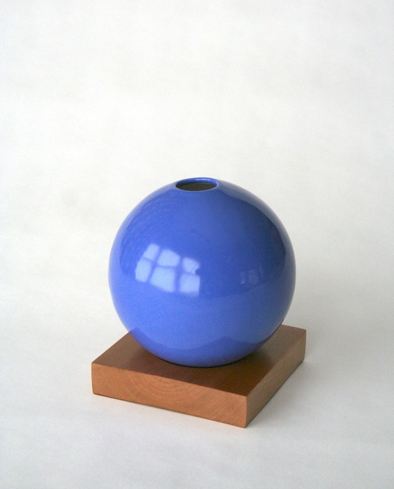 blue ceramic vase on wood base image 2