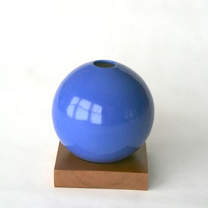 blue ceramic vase on wood base image 1