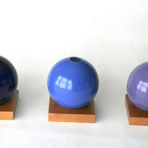 blue ceramic vase on wood base image 5