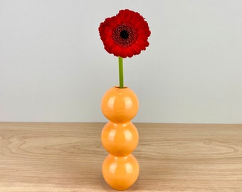 Orange ceramic bud vase