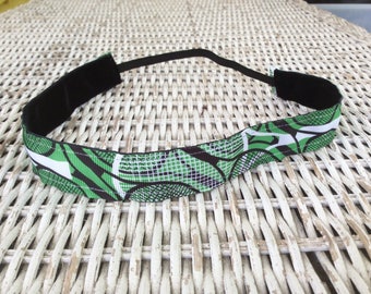 May include: A green, black and white patterned headband with a black elastic band.