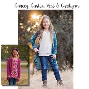 May include: A girl wearing a teal blue cardigan with a white shirt and blue jeans. The cardigan has a long, flowing design. The girl is standing in a field with green grass and trees in the background. The text "Darcey Duster, Vest & Cardigan" is at the top of the image. The text "Pattern brought to you by: Megan Thoman for Made for Mermaids simple & sweet PDF sewing patterns" is at the bottom of the image.