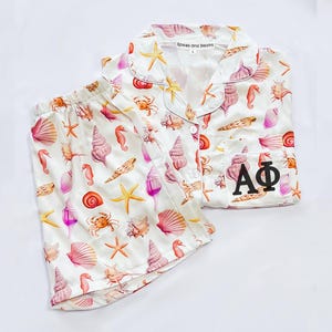 Alpha Phi, sorority pajamas, Alpha Phi merch, Alpha Phi tee, bid day, sorority gift basket, sorority gift, satin pajamas, sorority pjs