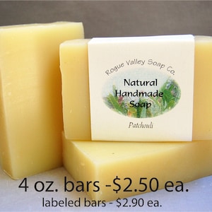 May include: Three bars of natural handmade patchouli soap. The bars are a light yellow color and are labeled with "Rogue Valley Soap Co." and "Natural Handmade Soap". Each bar weighs 4 oz.