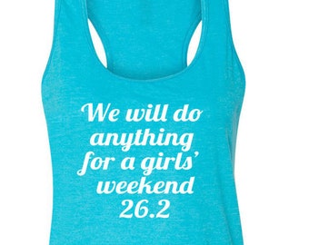 May include: A turquoise blue racerback tank top with the text "We will do anything for a girls' weekend 26.2" in white.