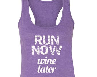 May include: Purple tank top with the text "RUN NOW wine later" in white.
