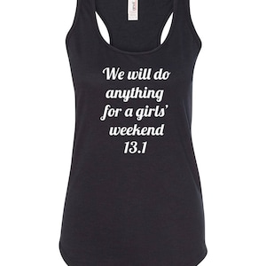 May include: Dark gray racerback tank top with white text that reads "We will do anything for a girls' weekend 13.1". The tank top has a scoop neck and is made of a soft material. Ideal for running or casual wear.